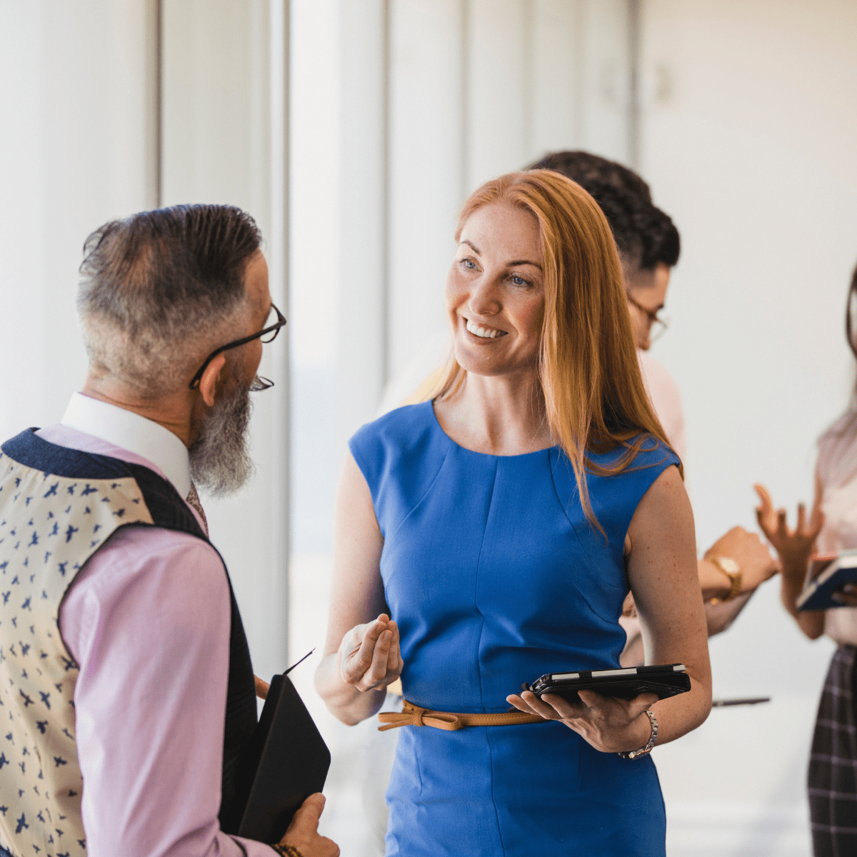 Man and woman talking at a conference